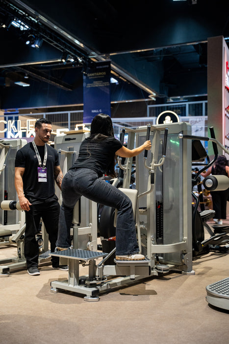 Rear three-quarter view of the Gluteleader Standing Adductor GL-1006 in use